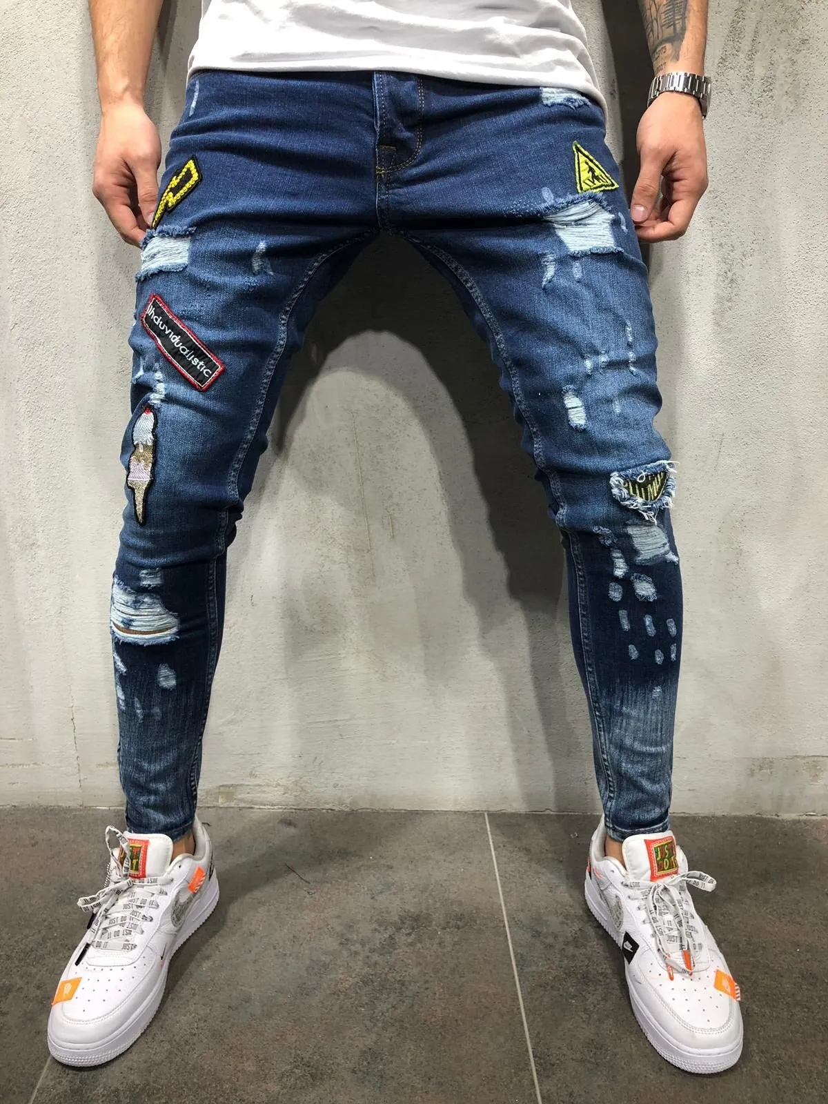 xBadges Distressed Skinny Jeans